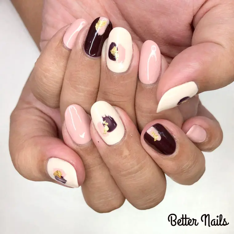 Cream and deep burgundy gel set with gold leaf accents