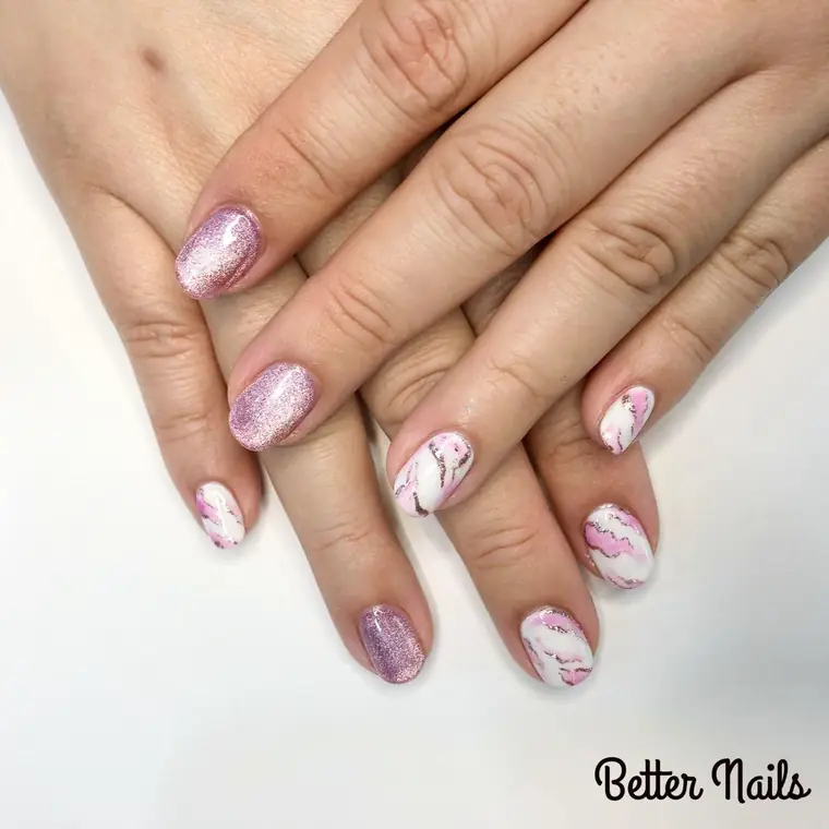 Pink shimmer gel with white marble accent nails