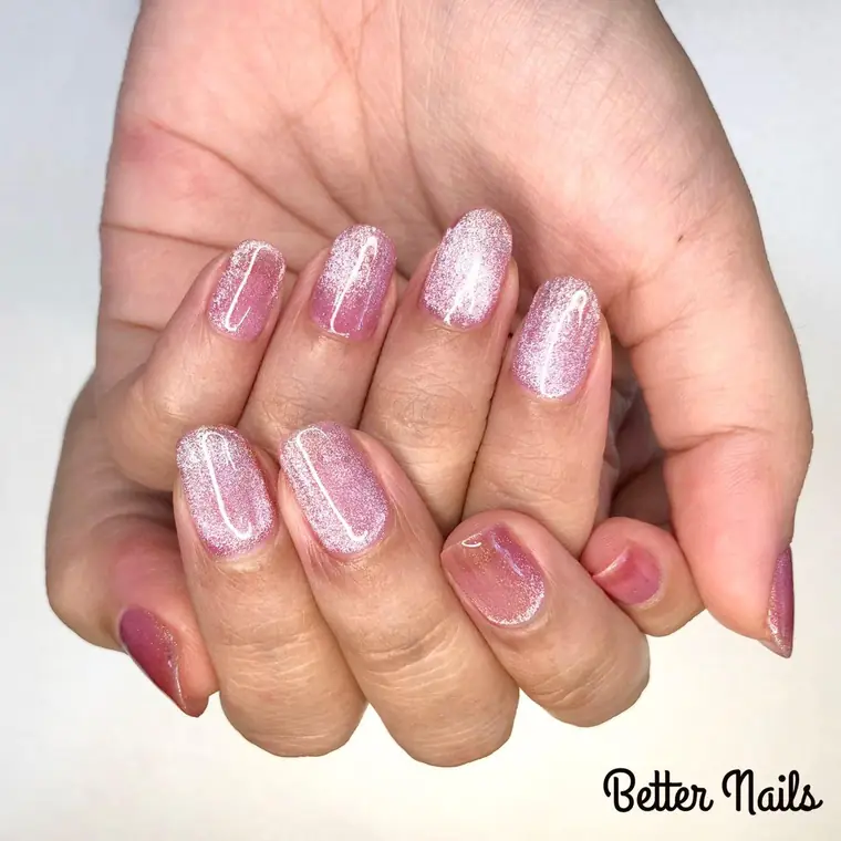 Pearl pink shimmer with a deep plum accent nail